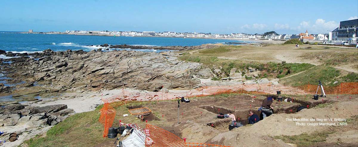Coastal landscape with archaeologists working in front and modern city landscape in the back